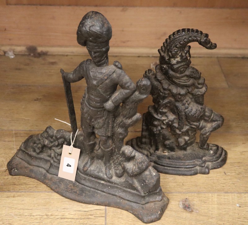 Two Victorian cast iron door stops - Highland soldier and Punch, larger 37cm